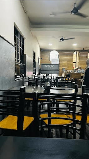 Bombay hotel kozhikode indoor seating with tables and chairs