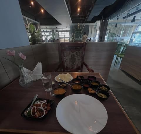 Hotel Sagar Kozhikode meals with specials on a wooden table