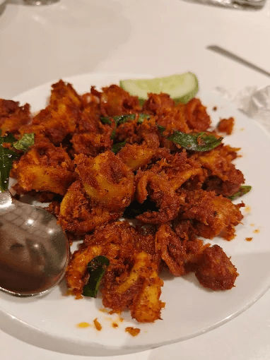 Hotel Sagar Kozhikode squid fry, a delicious fried seafood dish.