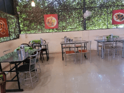 indoor dining area of tharavadu seafood restaurant